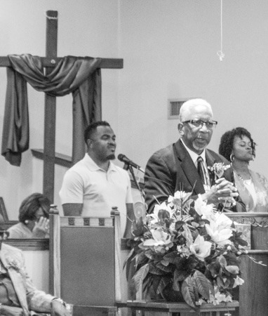Pastor Matthews preaching at New Mount Bethel