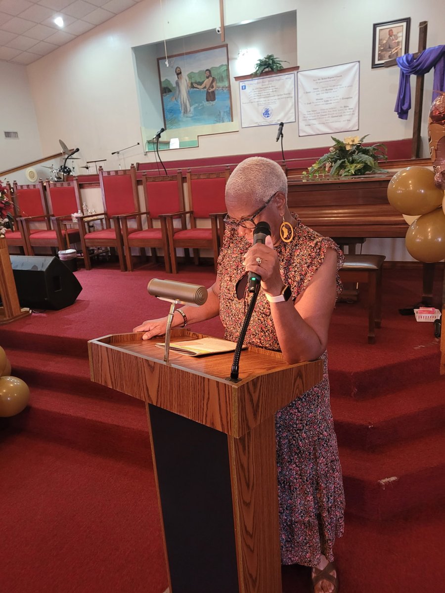 Leading prayer at New Mount Bethel